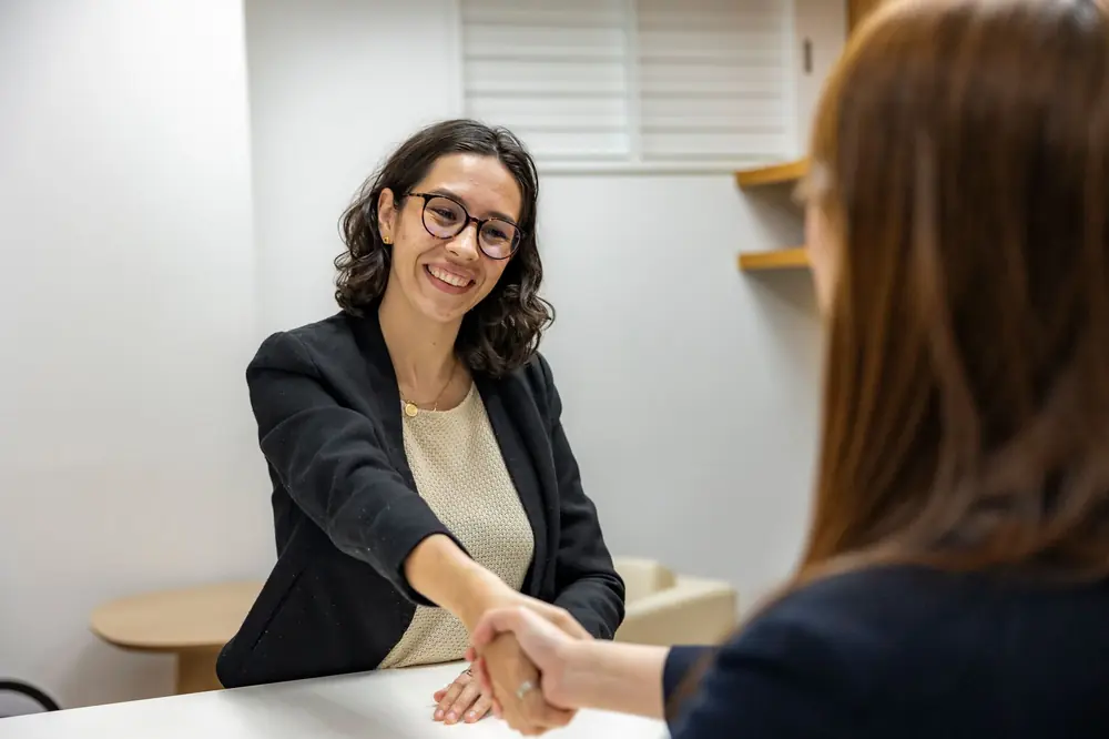 Candidate shaking hands with a recruiter after an interview